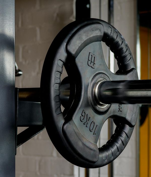 Abstract dark heavy metallic weights in a gym environment